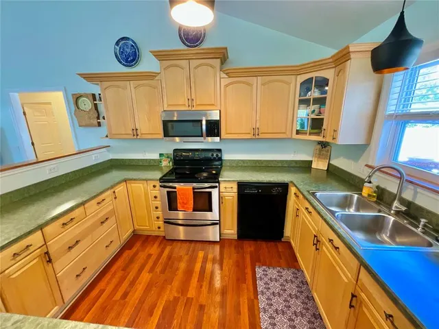 a bedroom with bed and a chandelier