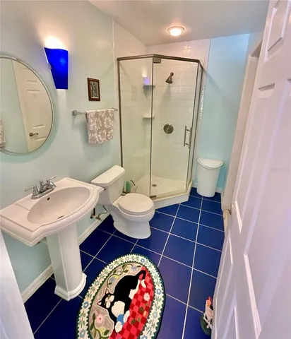 a bedroom with a bed and a view of bedroom