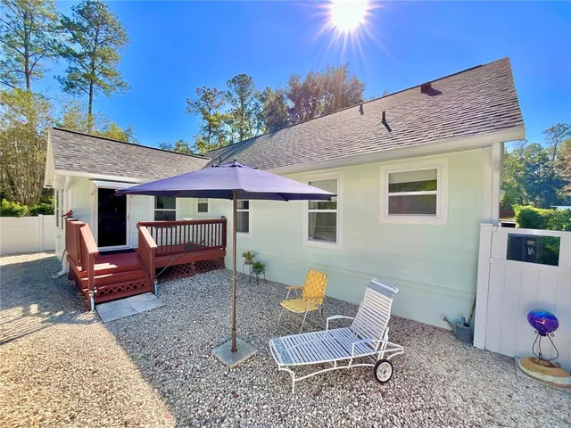 a swimming pool with outdoor seating