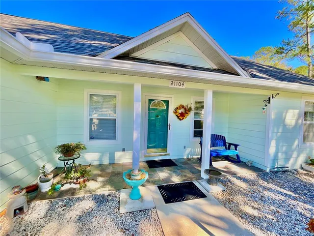 view of a large body of water with a building in the background