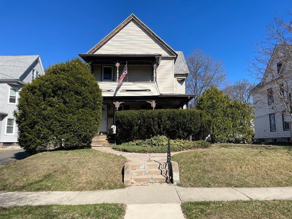 a front view of a house with a yard