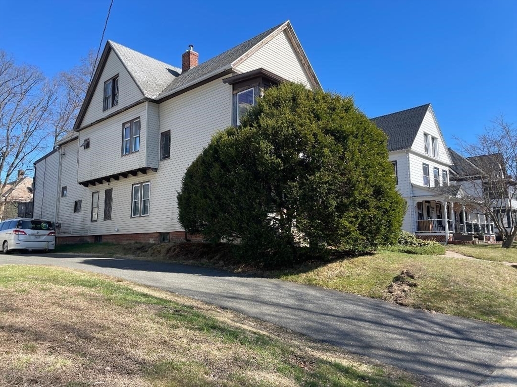 76 Nonotuck Street Holyoke, MA 01040 - Photo 2 of 6 a view of a house with a yard