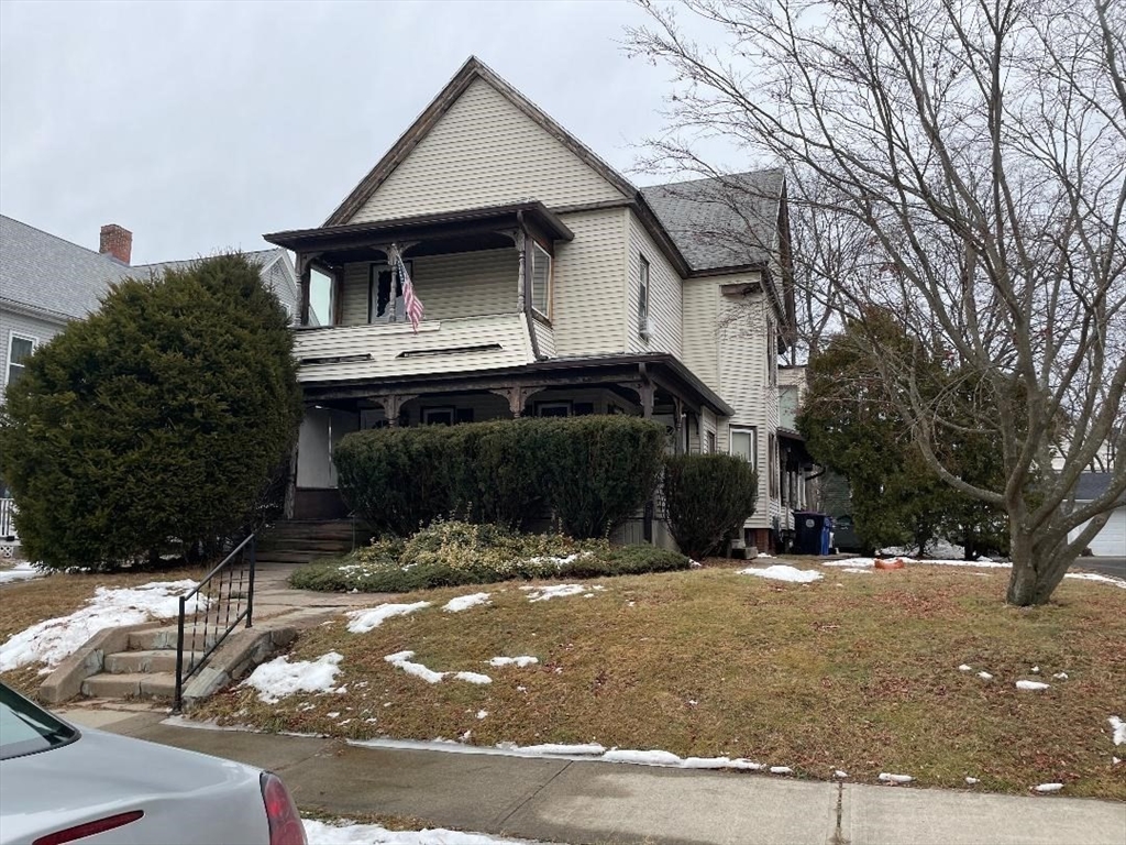 76 Nonotuck Street Holyoke, MA 01040 - Photo 2 of 6 a front view of a house with a yard