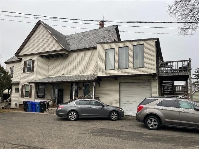 a view of a car parked in front of a house