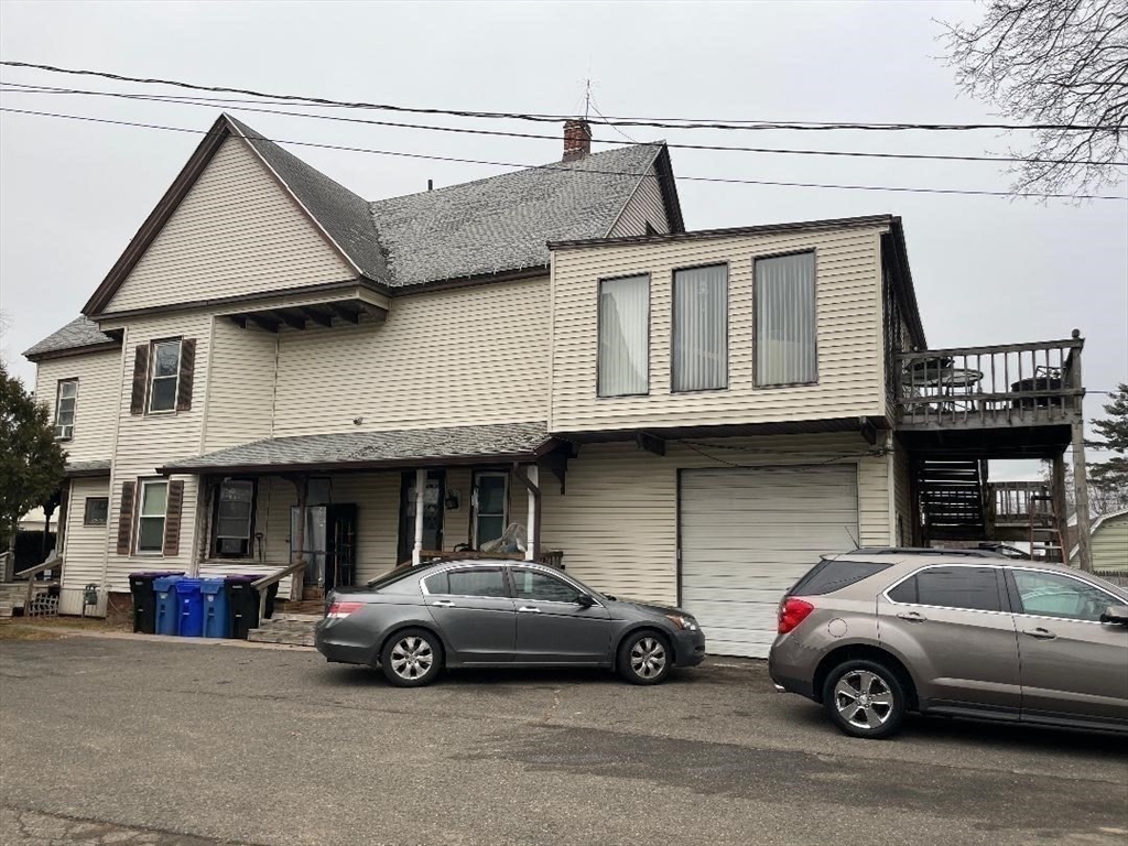 76 Nonotuck Street Holyoke, MA 01040 - Photo 4 of 6 a view of a car parked in front of a house