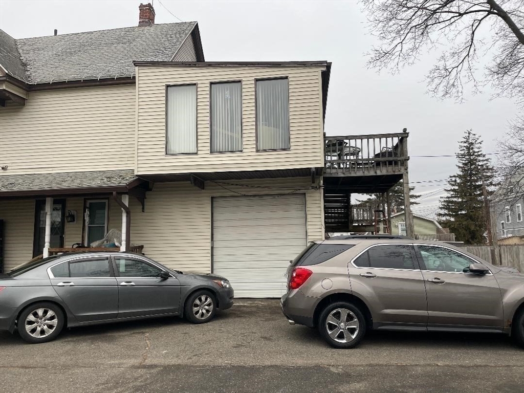 76 Nonotuck Street Holyoke, MA 01040 - Photo 5 of 6 a car parked in front of a building