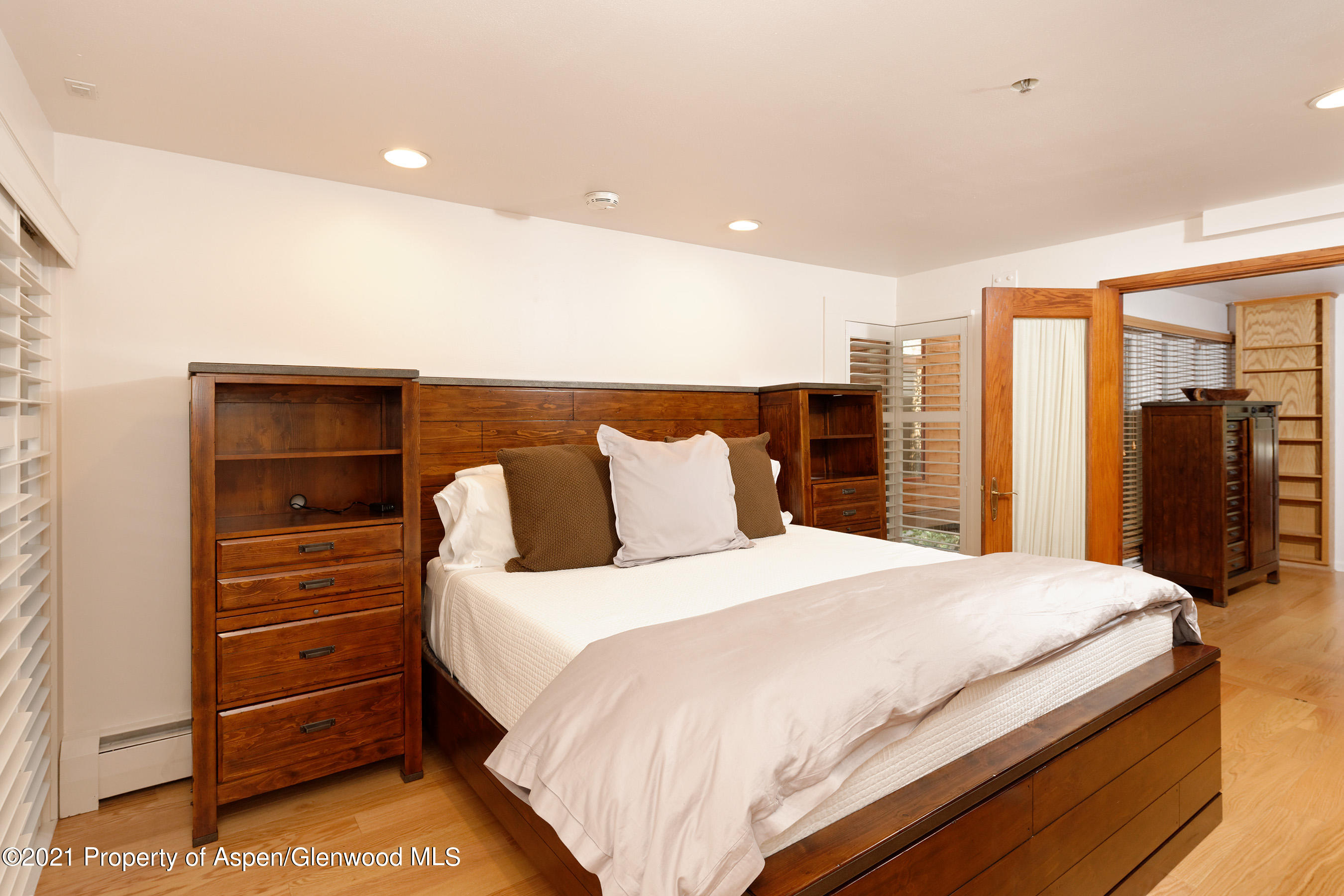 900 East Durant Avenue, Unit B105 Aspen, CO 81611 - Photo 5 of 18 a bedroom with a bed and a closet