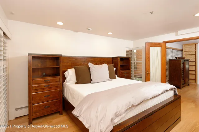 a bedroom with a bed and a closet