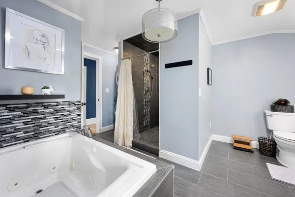 a kitchen with stainless steel appliances a refrigerator and a stove top oven