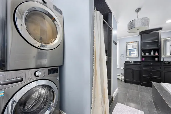 a view of a hallway with washer and dryer