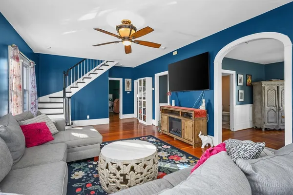 a living room with furniture and a flat screen tv