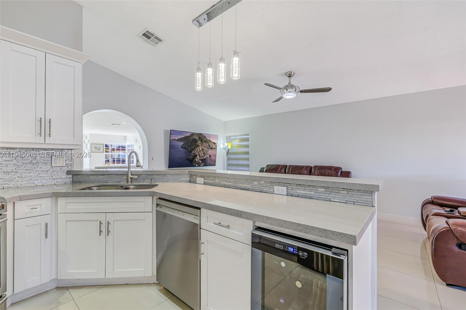 9526 Southwest 155th Avenue Miami, FL 33196 - Photo 20 of 53 a kitchen with a sink stove and cabinets