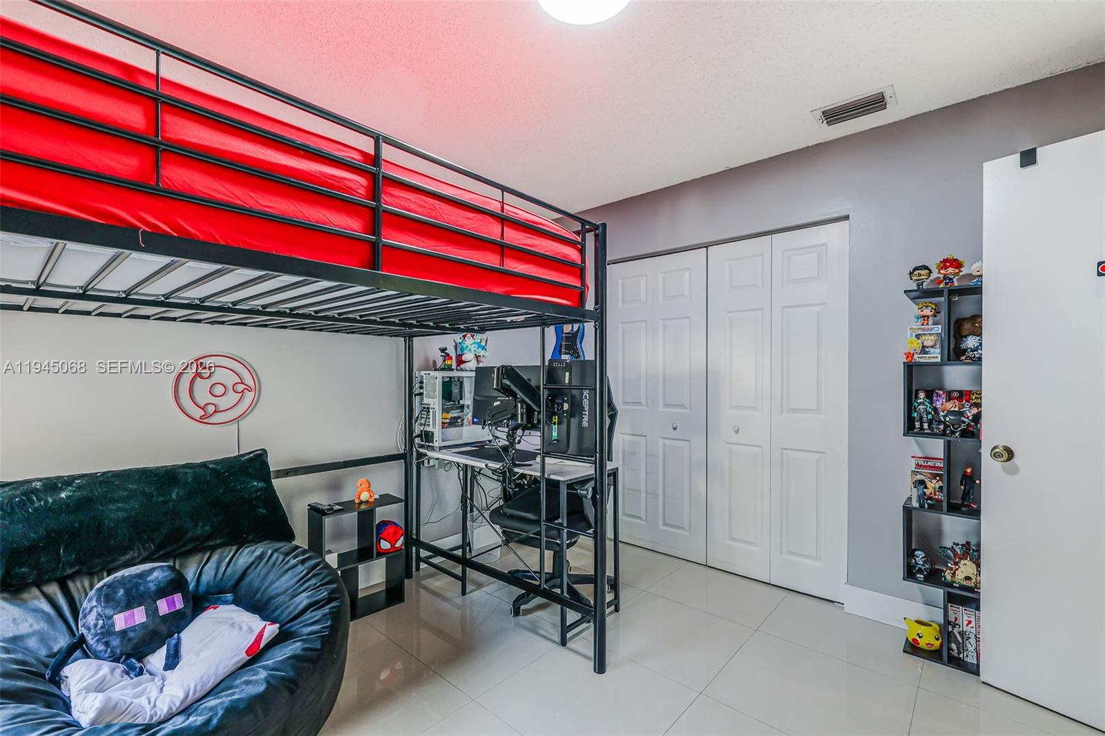 9526 Southwest 155th Avenue Miami, FL 33196 - Photo 24 of 53 a view of a room with racks on the wall and a potted plant