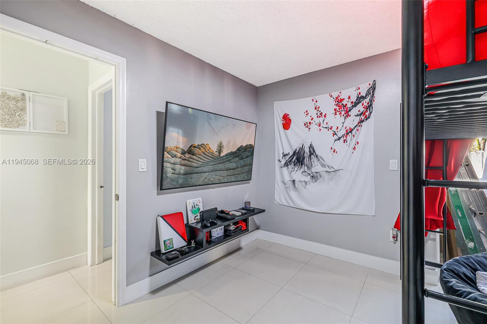 9526 Southwest 155th Avenue Miami, FL 33196 - Photo 25 of 53 a view of a hallway with paintings on the wall