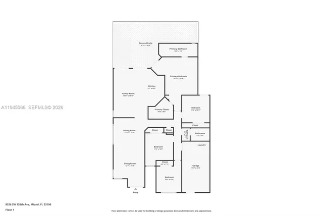 an aerial view of a city with lots of residential buildings ocean and mountain view in back