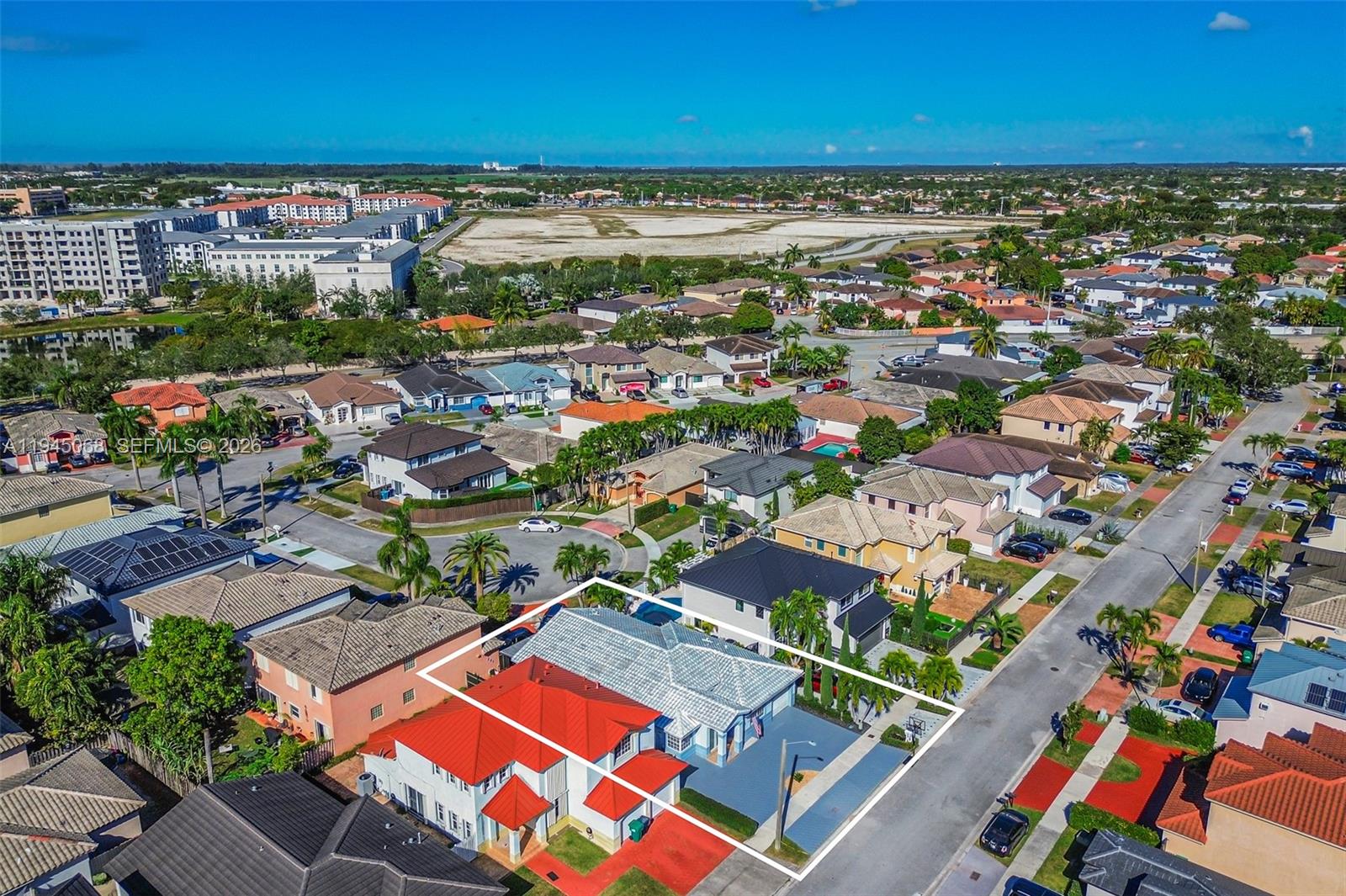 9526 Southwest 155th Avenue Miami, FL 33196 - Photo 51 of 53 an aerial view of a city with lots of residential buildings ocean and mountain view in back