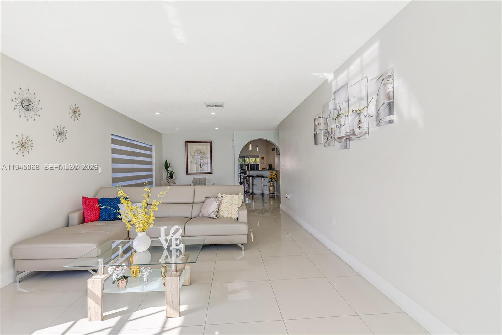 9526 Southwest 155th Avenue Miami, FL 33196 - Photo 6 of 53 a living room with furniture and stairs