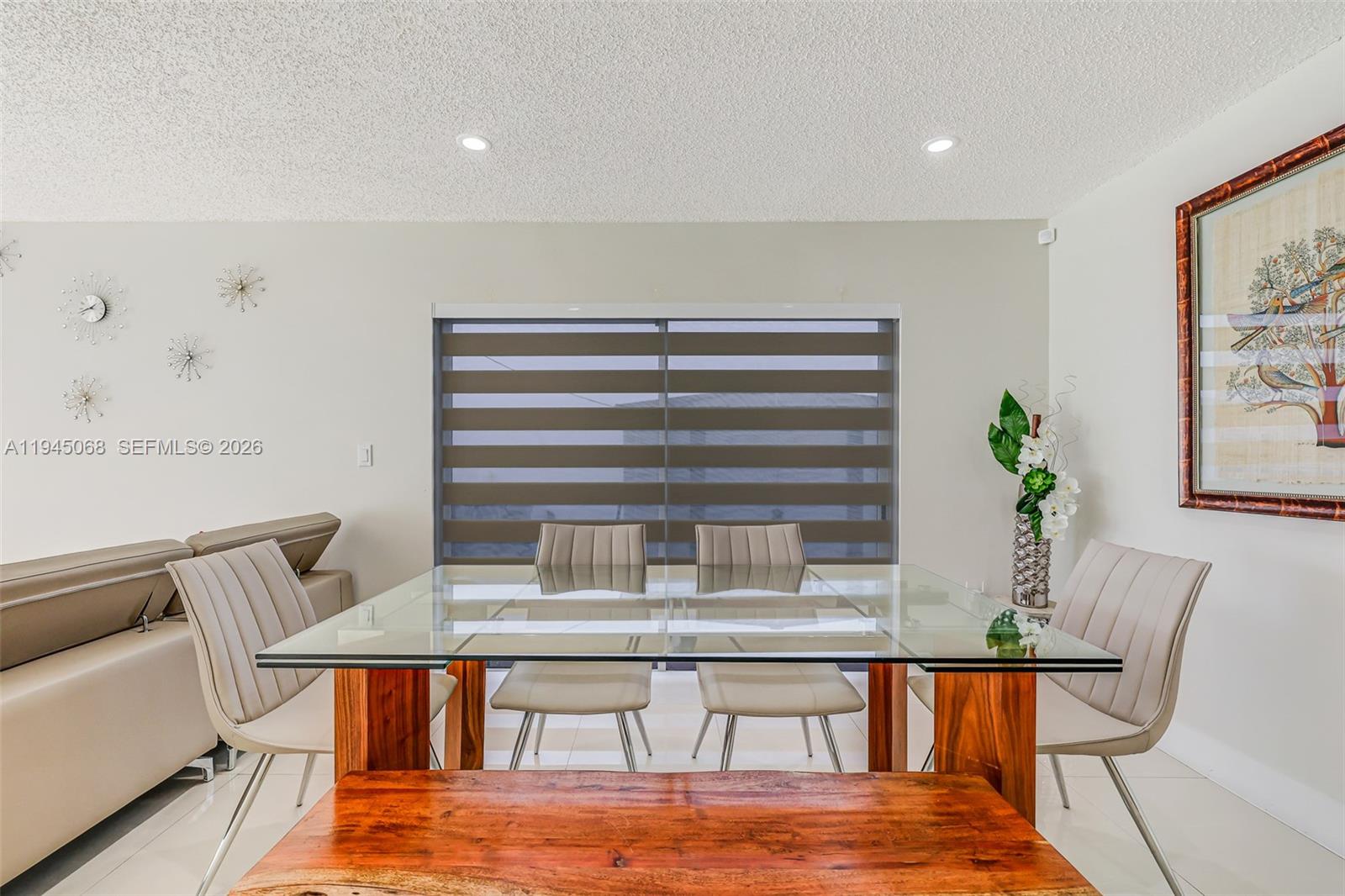 9526 Southwest 155th Avenue Miami, FL 33196 - Photo 10 of 53 a dining room with furniture and wooden floor