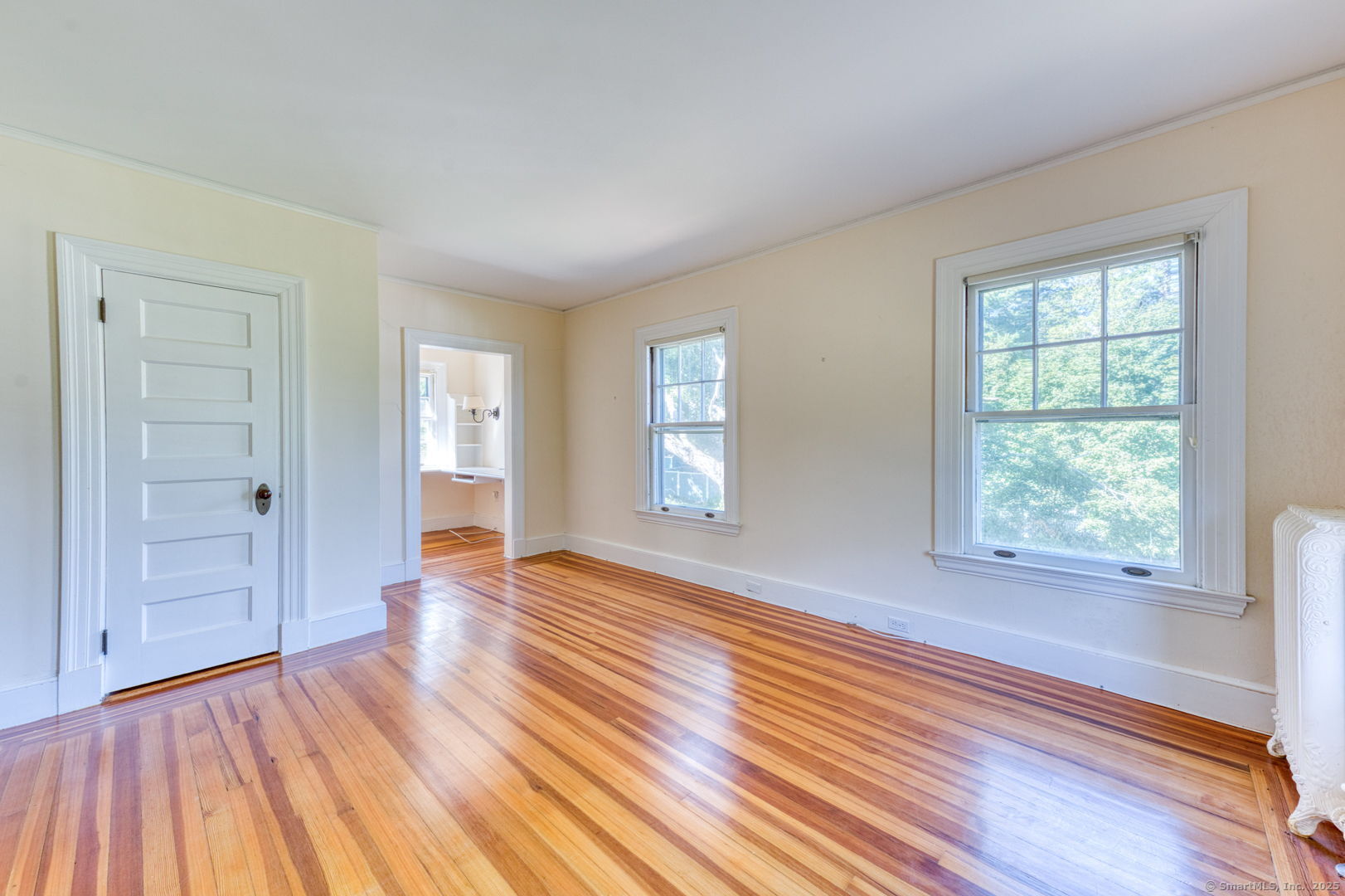 202 South Main Street Manchester, CT 06040 - Photo 24 of 40 an empty room with wooden floor and windows