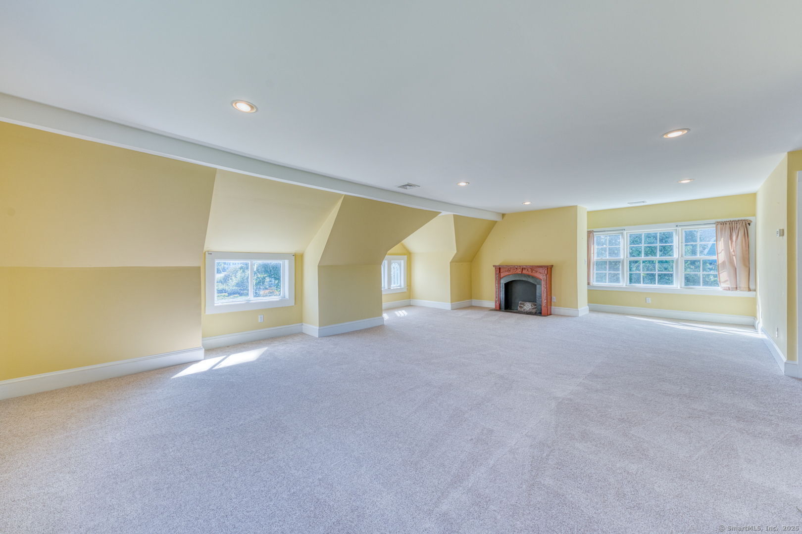 202 South Main Street Manchester, CT 06040 - Photo 27 of 40 a view of an empty room with a fireplace and a window