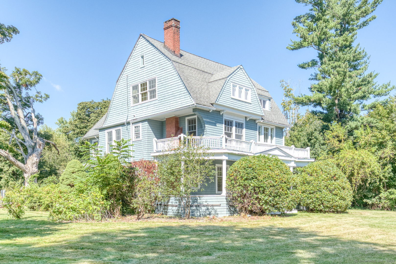 202 South Main Street Manchester, CT 06040 - Photo 3 of 40 a front view of a house with a garden