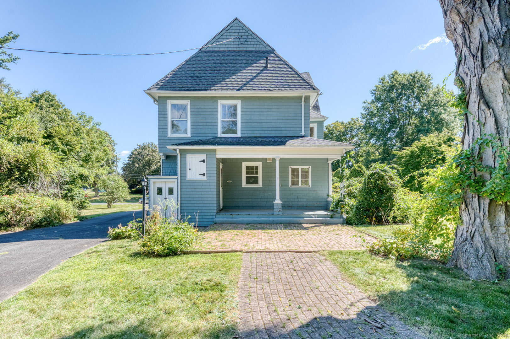 202 South Main Street Manchester, CT 06040 - Photo 4 of 40 a front view of a house with a yard