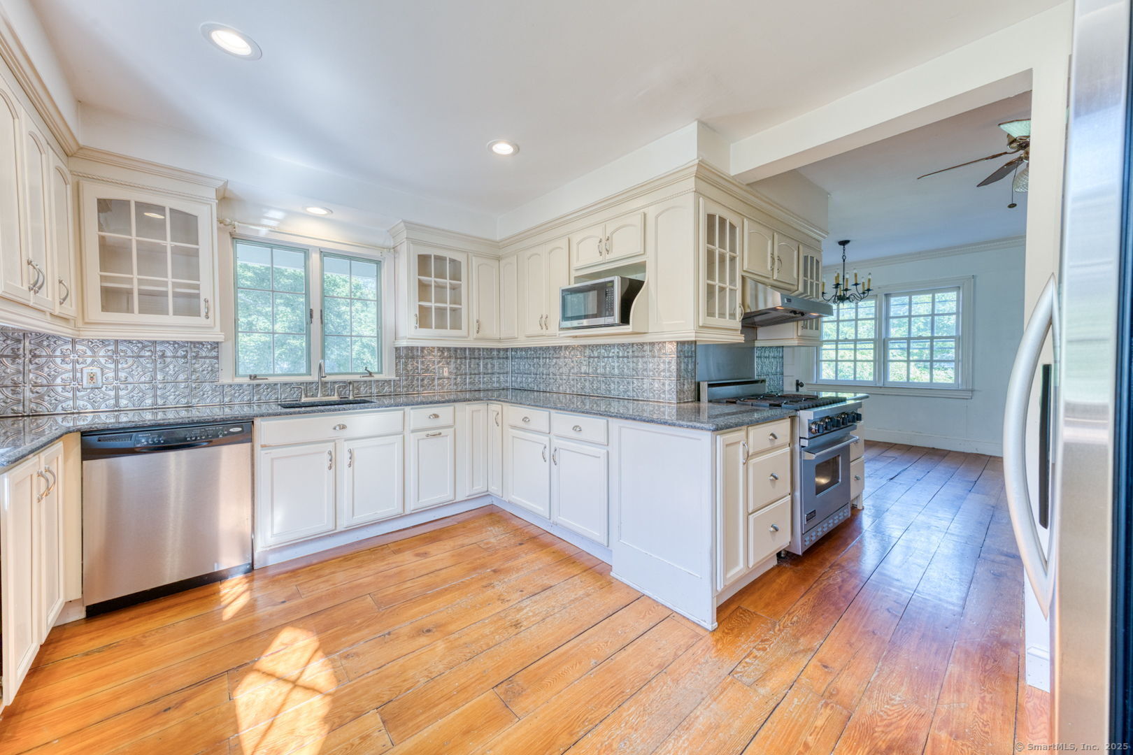 202 South Main Street Manchester, CT 06040 - Photo 5 of 40 a kitchen with stainless steel appliances granite countertop a stove and a sink