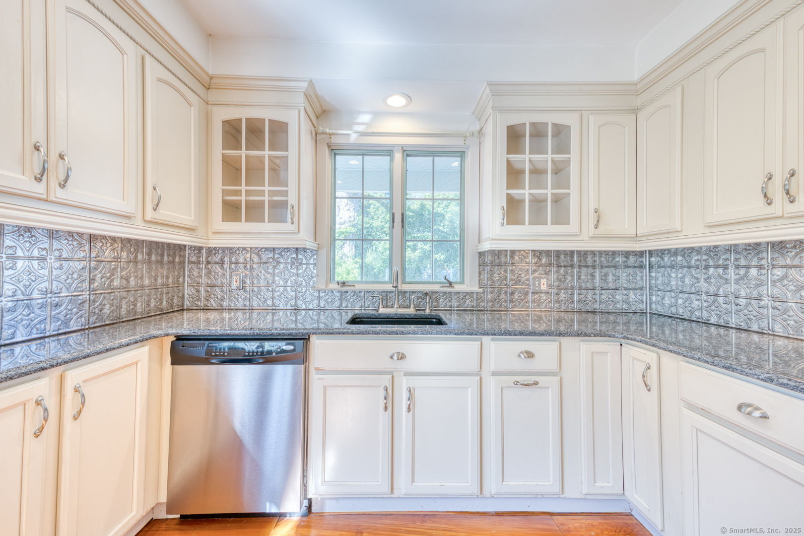 202 South Main Street Manchester, CT 06040 - Photo 7 of 40 a kitchen with granite countertop white cabinets and sink