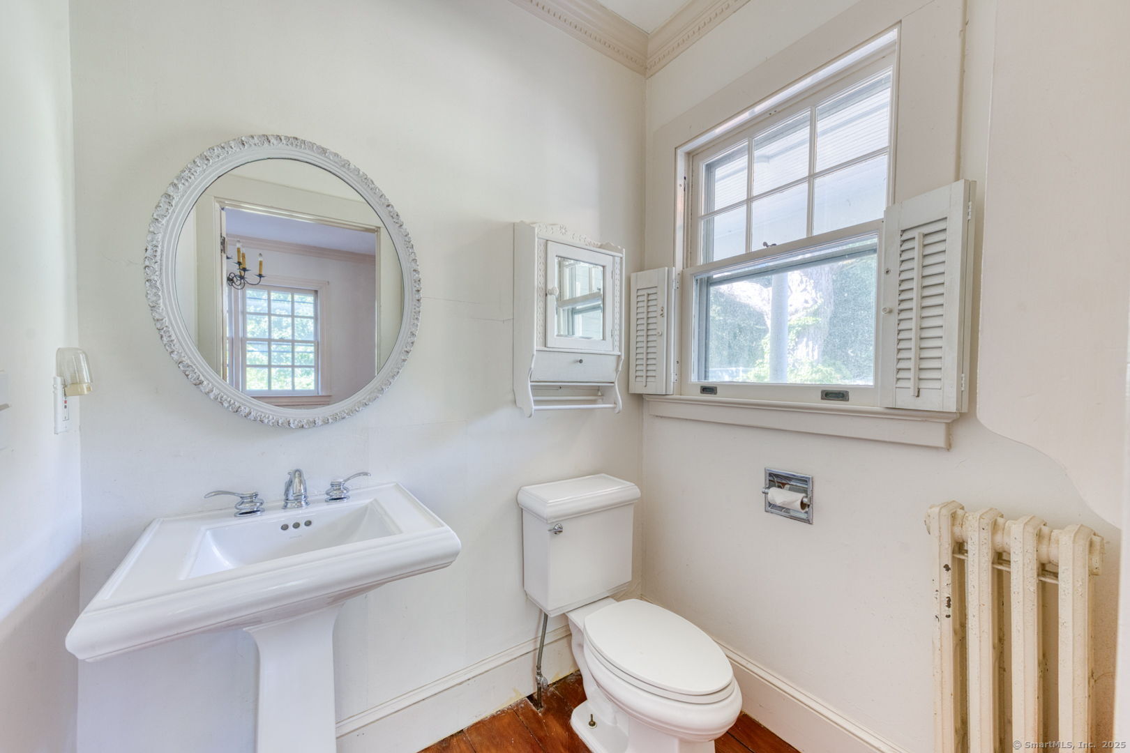 202 South Main Street Manchester, CT 06040 - Photo 10 of 40 a bathroom with a toilet a sink and mirror