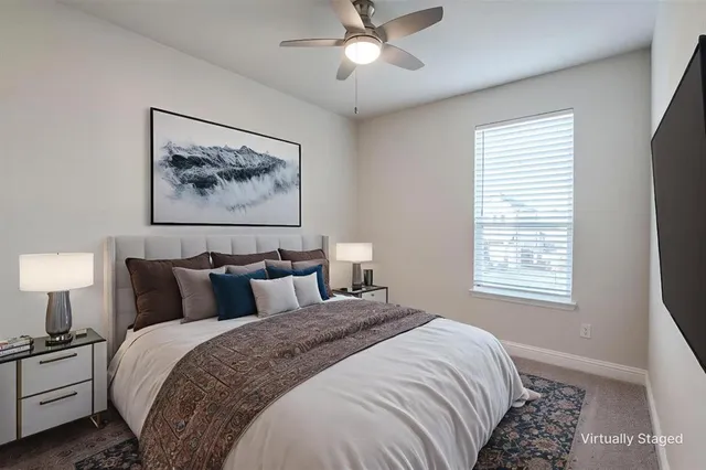 a bedroom with bed and window