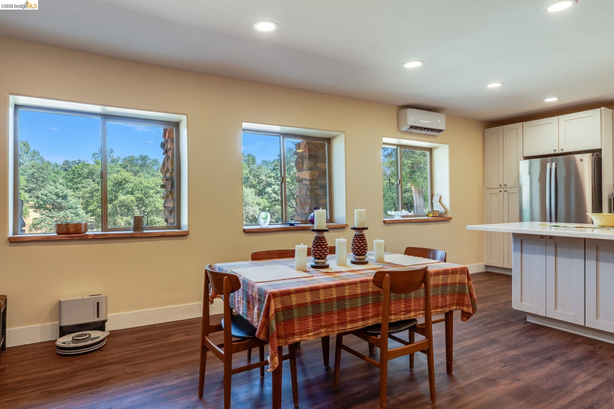 4600 El Caminito Road Shingle Springs, CA 95682 - Photo 40 of 60 a view of a dining room with furniture windows and wooden floor