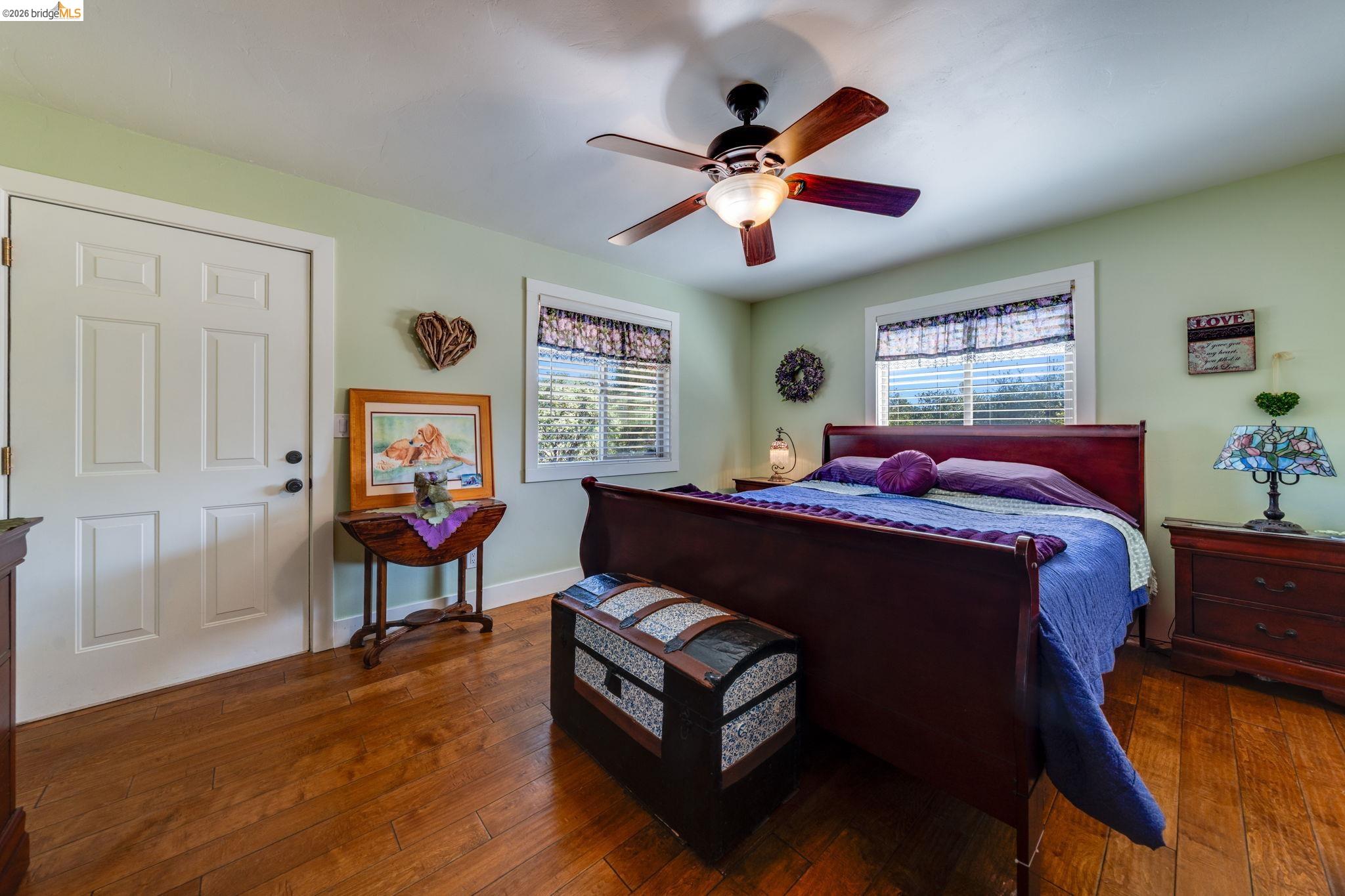 4600 El Caminito Road Shingle Springs, CA 95682 - Photo 46 of 60 a bedroom with a bed and a chandelier
