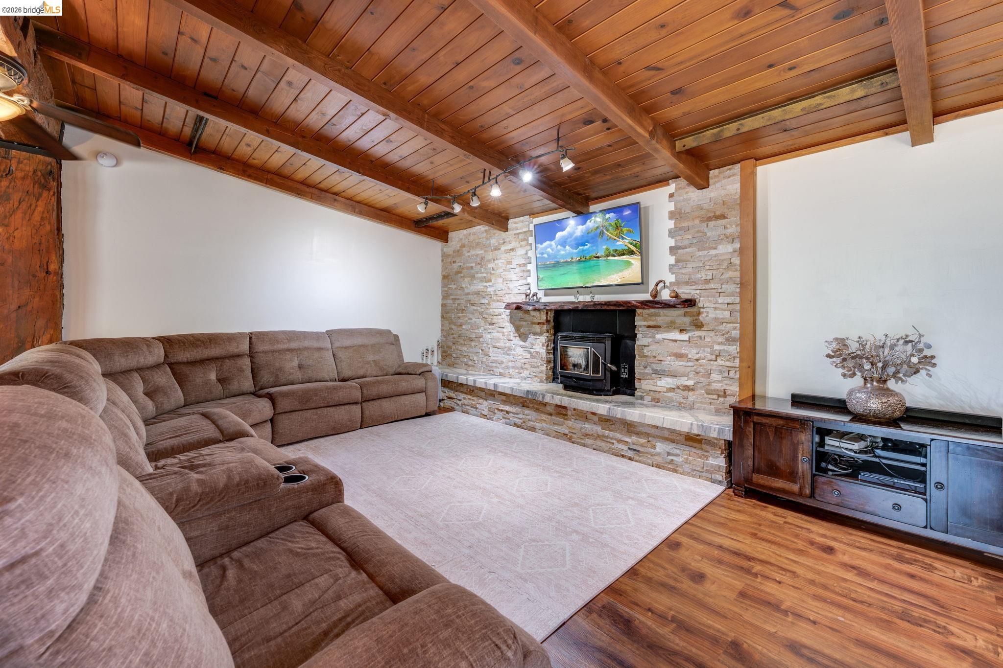4600 El Caminito Road Shingle Springs, CA 95682 - Photo 6 of 60 a living room with furniture a fireplace and a flat screen tv