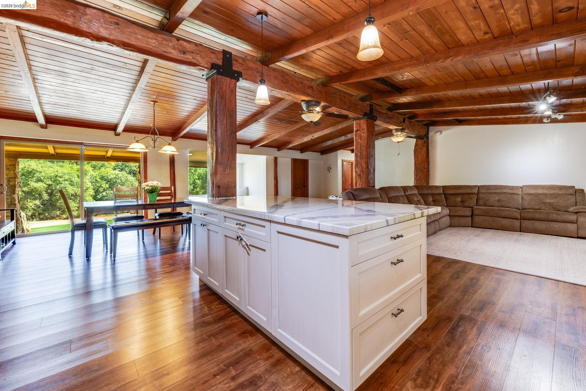 4600 El Caminito Road Shingle Springs, CA 95682 - Photo 10 of 60 a kitchen with stainless steel appliances granite countertop wooden floors and white walls