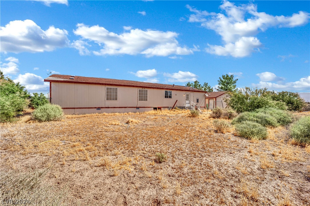 4361 Maple Road Pahrump, NV 89048 - Photo 41 of 46 A spacious desert-scape property offers a single-story residence with ample outdoor potential.