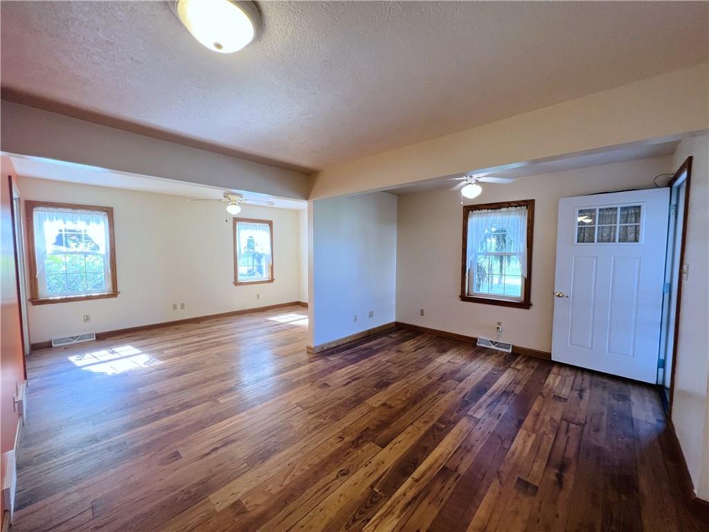 2764 Old Butler Road New Castle, PA 16101 - Photo 19 of 25 an empty room with wooden floor and windows