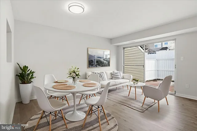 a dining room with furniture and window