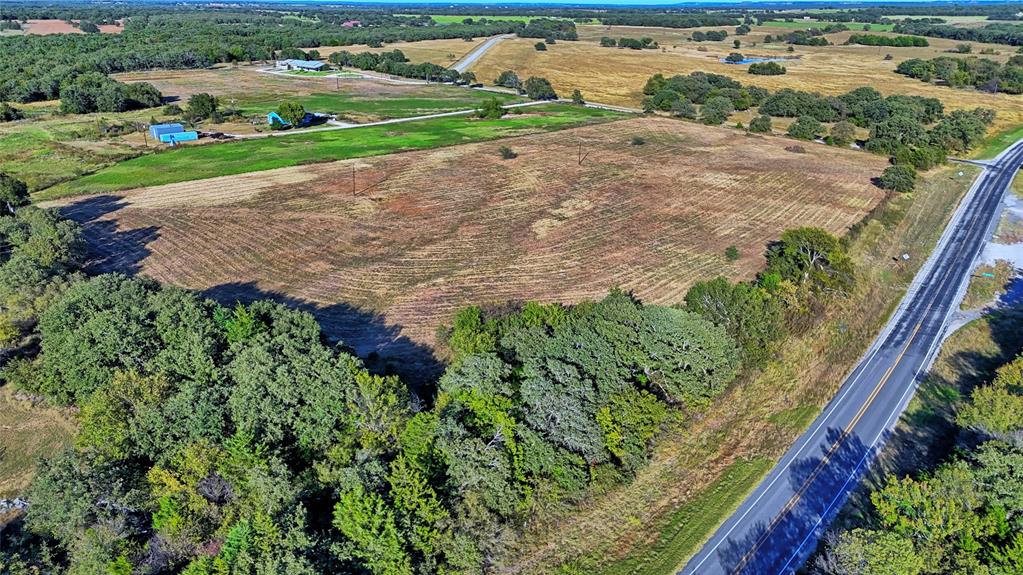 4678 Fenoglio Road Montague, TX 76251 - Photo 11 of 20 a view of a garden with a building in the background