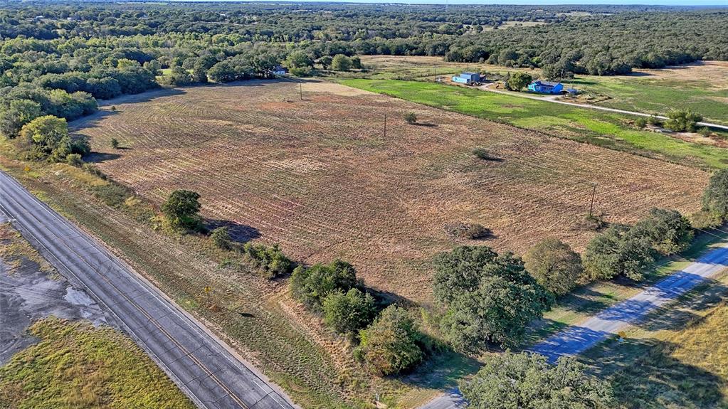 4678 Fenoglio Road Montague, TX 76251 - Photo 9 of 20 a view of a street with a yard