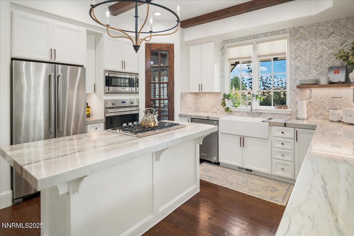 6360 Wetzel Court Reno, NV 89511 - Photo 16 of 43 a kitchen with stainless steel appliances a sink stove and cabinets