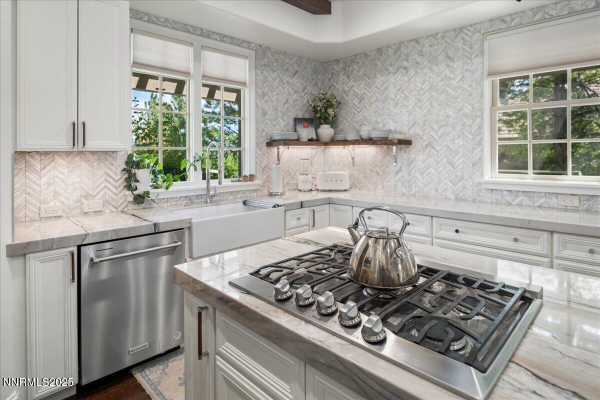6360 Wetzel Court Reno, NV 89511 - Photo 18 of 43 a kitchen with a stove a sink and a window