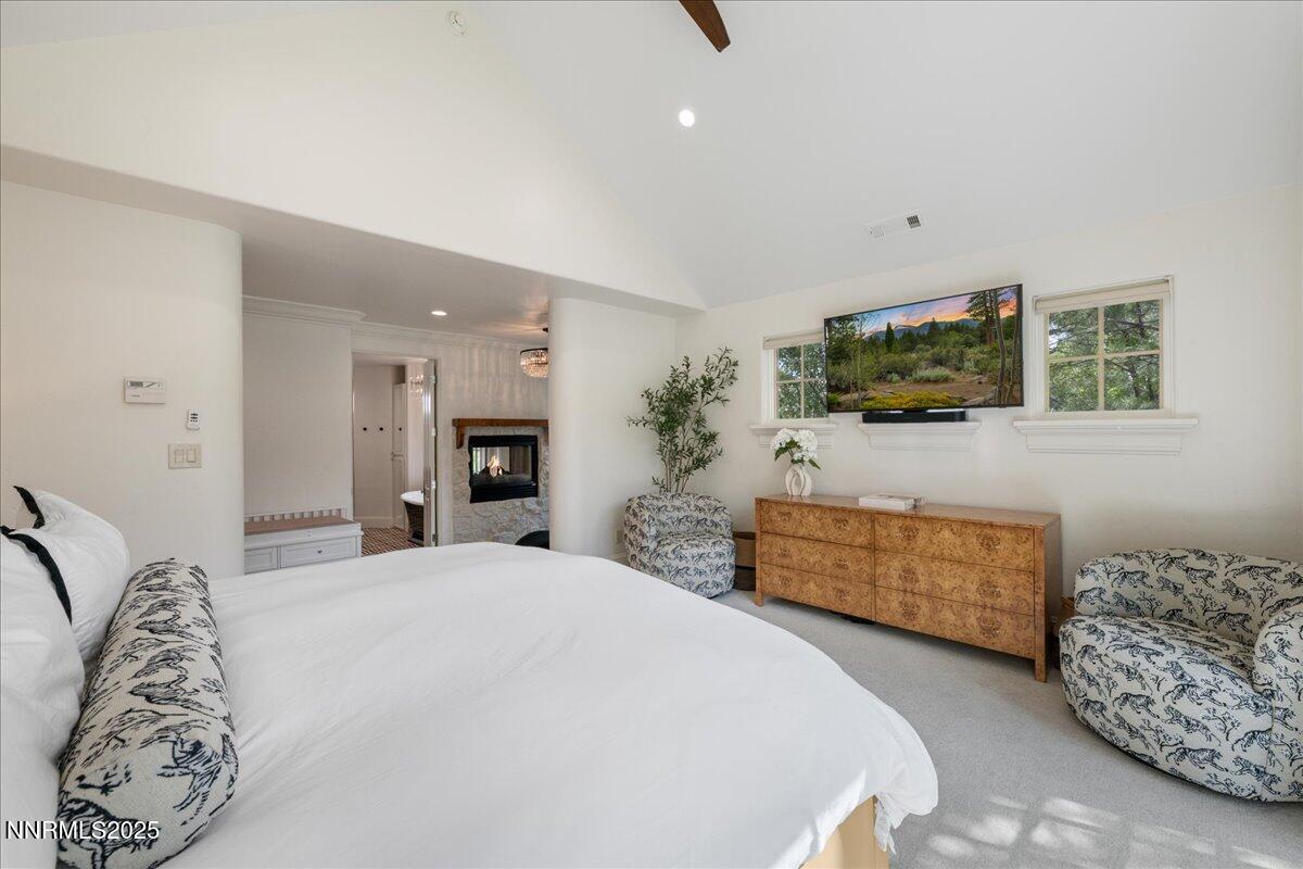 6360 Wetzel Court Reno, NV 89511 - Photo 24 of 43 a bedroom with a bed and a flat screen tv