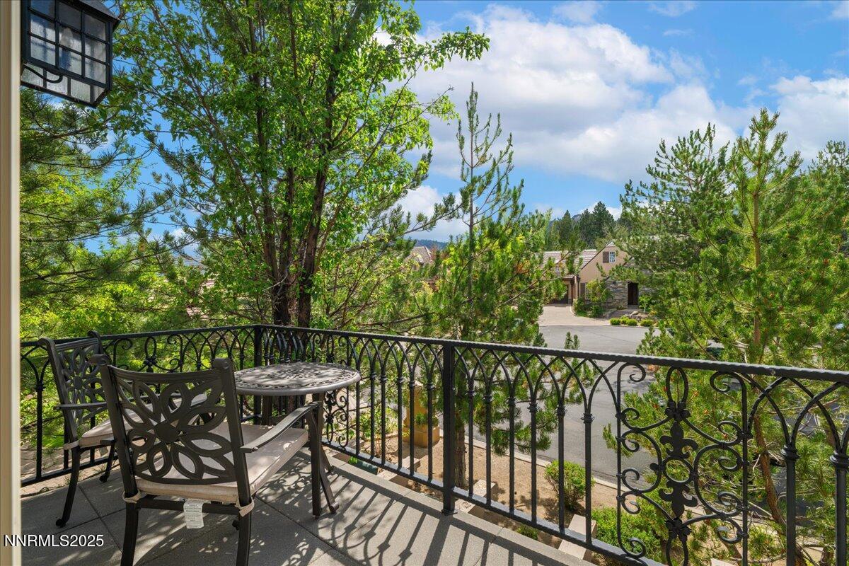 6360 Wetzel Court Reno, NV 89511 - Photo 25 of 43 a view of a balcony with mountain view and wooden floor