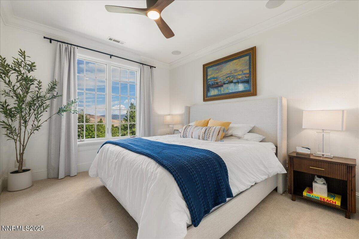 6360 Wetzel Court Reno, NV 89511 - Photo 31 of 43 a bedroom with a large bed and a window