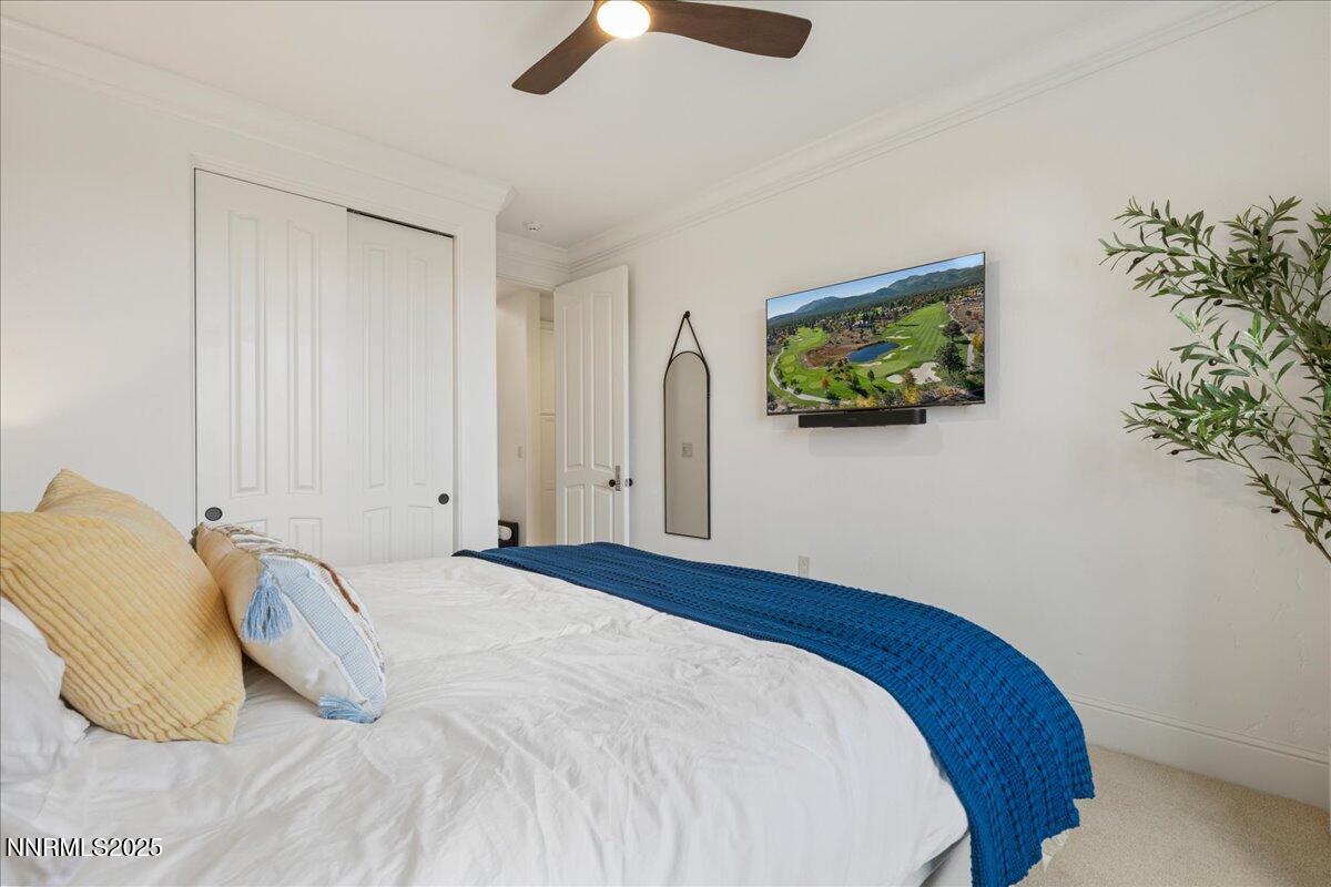 6360 Wetzel Court Reno, NV 89511 - Photo 32 of 43 a bedroom with a bed and a potted plant