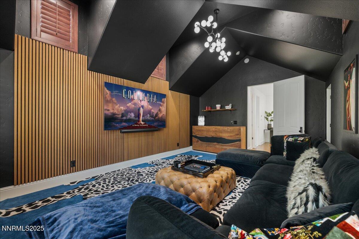 6360 Wetzel Court Reno, NV 89511 - Photo 35 of 43 a living room with furniture and a chandelier