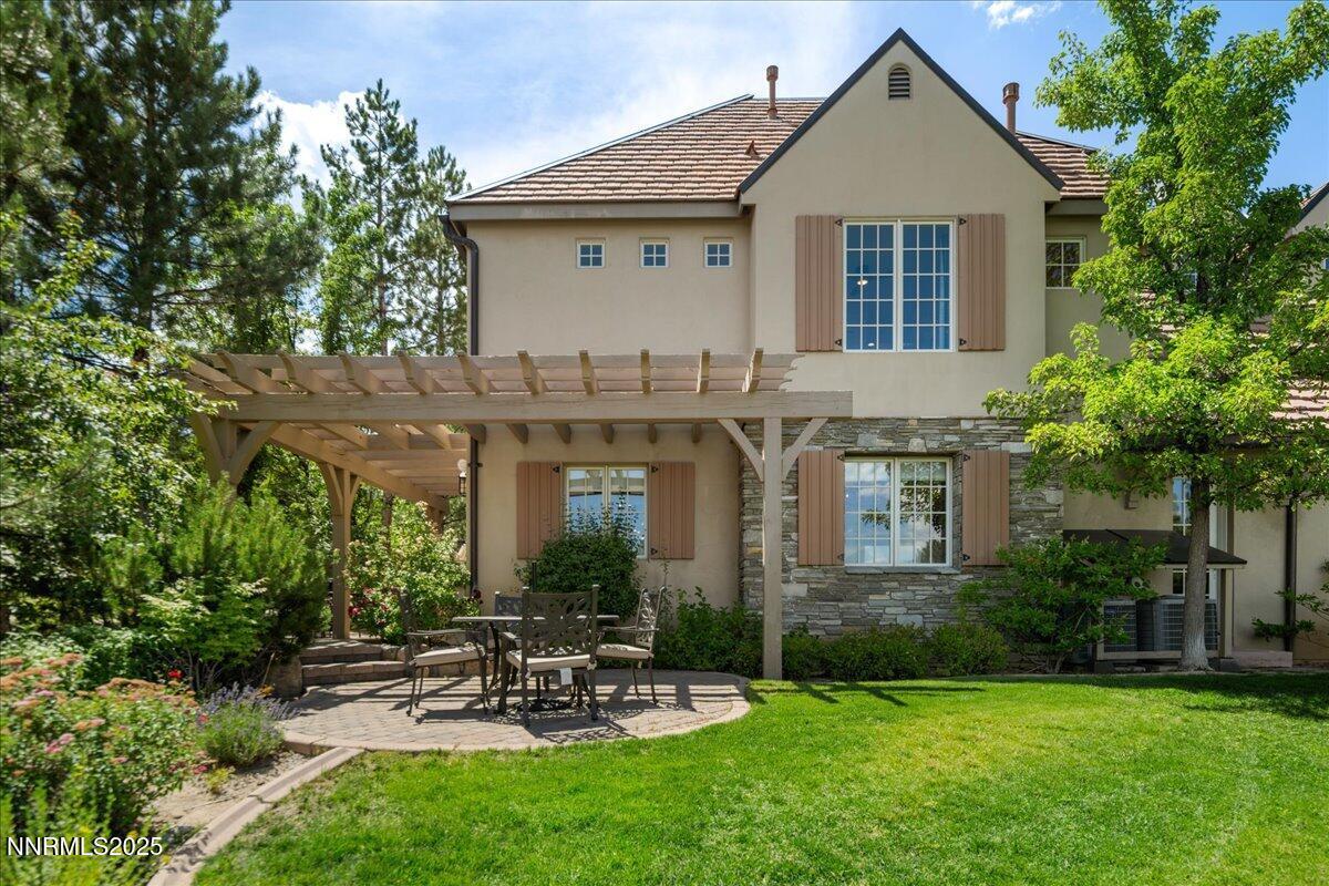 6360 Wetzel Court Reno, NV 89511 - Photo 37 of 43 a front view of a house with a garden and plants