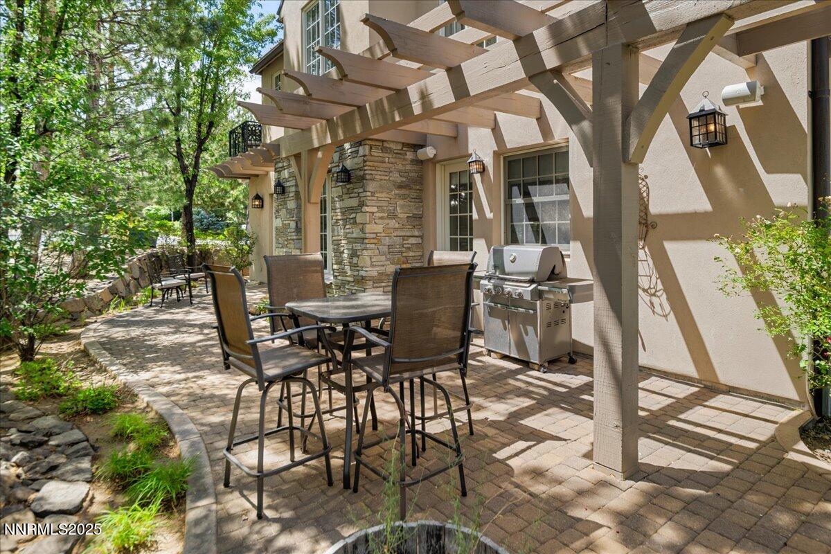 6360 Wetzel Court Reno, NV 89511 - Photo 39 of 43 a view of a patio with table and chairs and potted plants