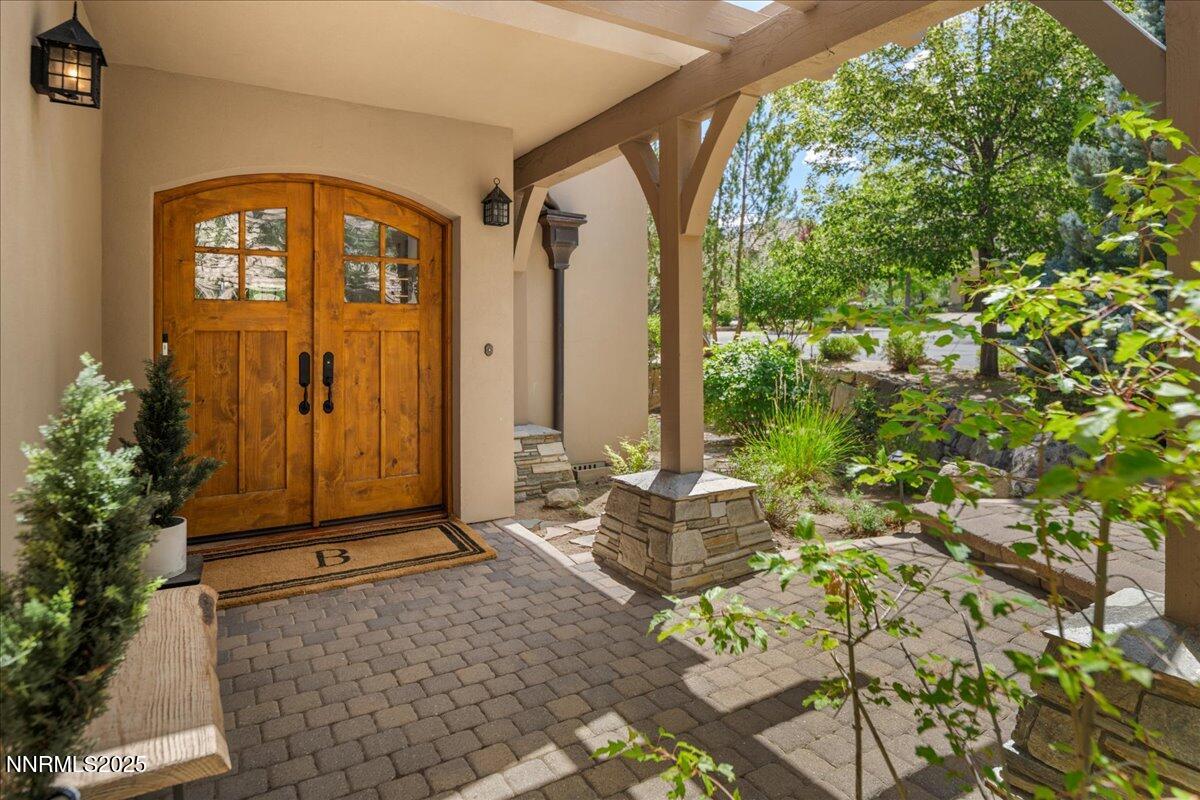 6360 Wetzel Court Reno, NV 89511 - Photo 4 of 43 a front view of a house with a garden