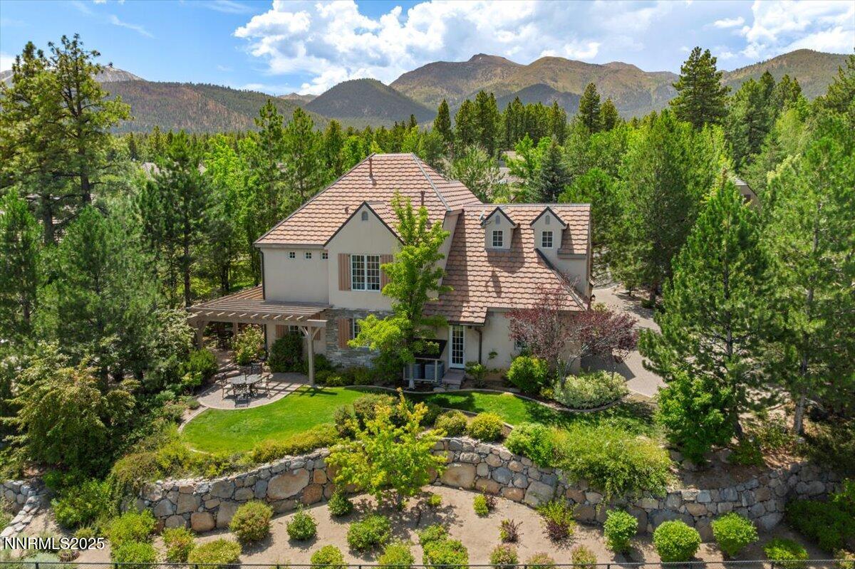 6360 Wetzel Court Reno, NV 89511 - Photo 41 of 43 a front view of a house with a yard and large tree